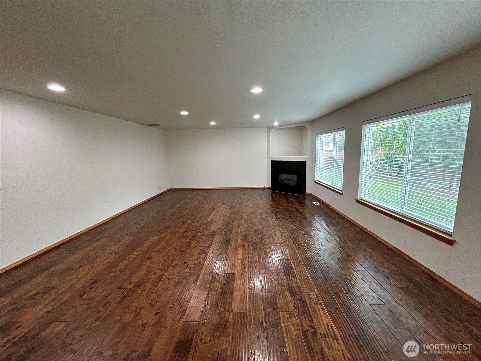 31114 29th Court Southwest Federal Way, WA 98023 - Photo 14 of 40 an empty room with wooden floor and windows