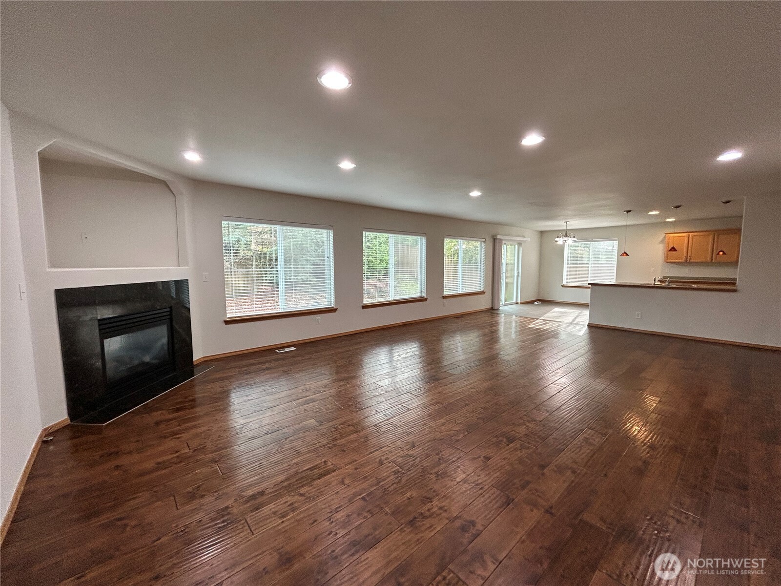31114 29th Court Southwest Federal Way, WA 98023 - Photo 15 of 40 an empty room with wooden floor fireplace and windows
