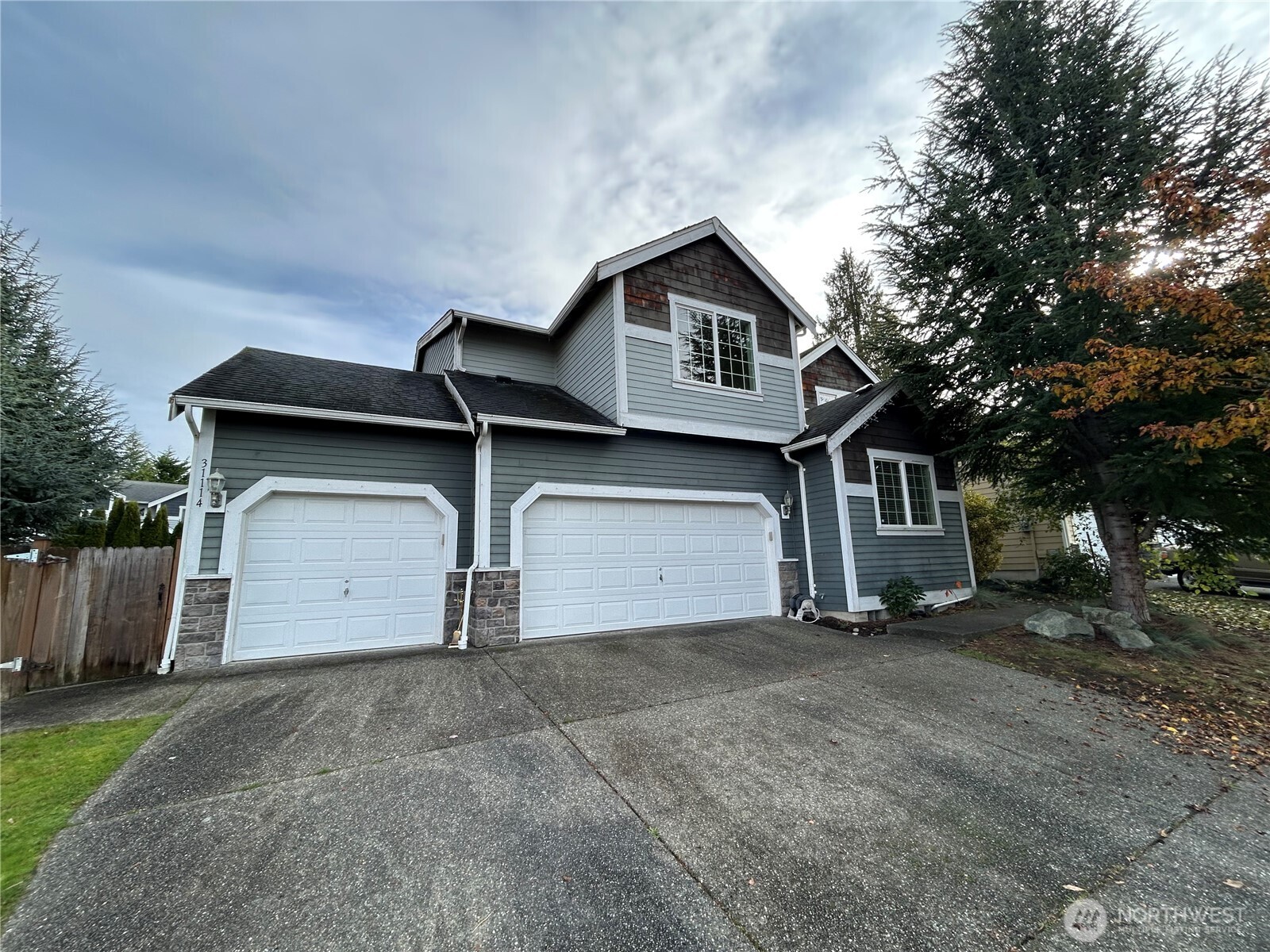 31114 29th Court Southwest Federal Way, WA 98023 - Photo 2 of 40 a front view of a house with a yard and garage