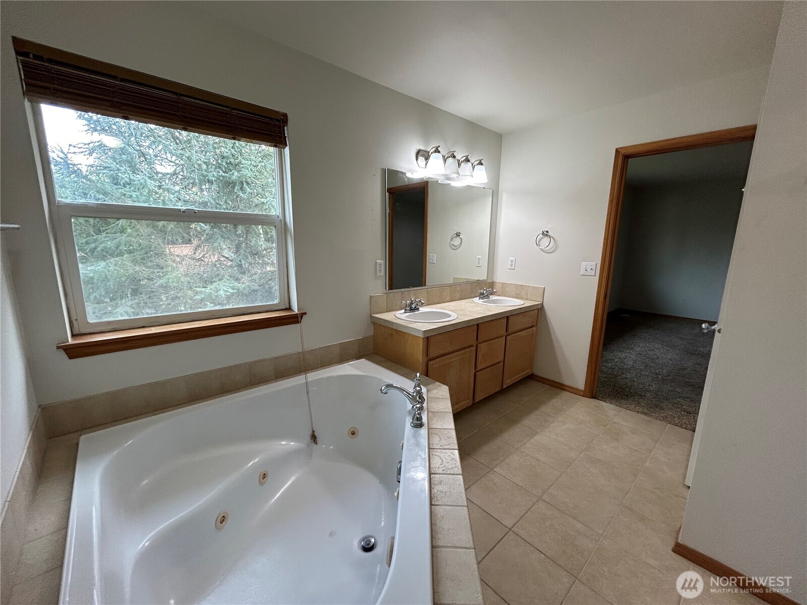 31114 29th Court Southwest Federal Way, WA 98023 - Photo 29 of 40 a bathroom with a tub sink and mirror