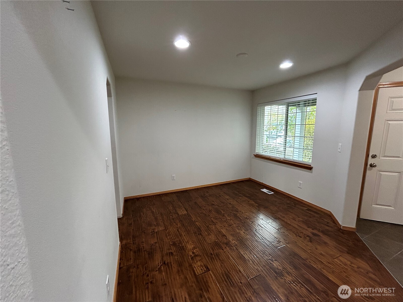 31114 29th Court Southwest Federal Way, WA 98023 - Photo 6 of 40 an empty room with wooden floor and windows