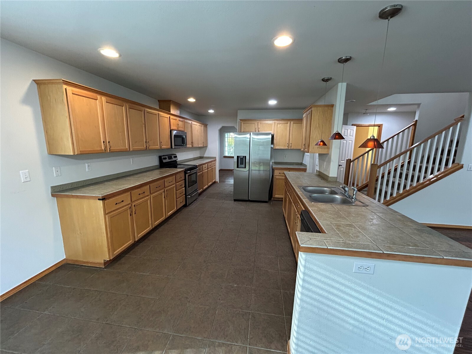 31114 29th Court Southwest Federal Way, WA 98023 - Photo 8 of 40 a kitchen with stainless steel appliances granite countertop a stove and a sink