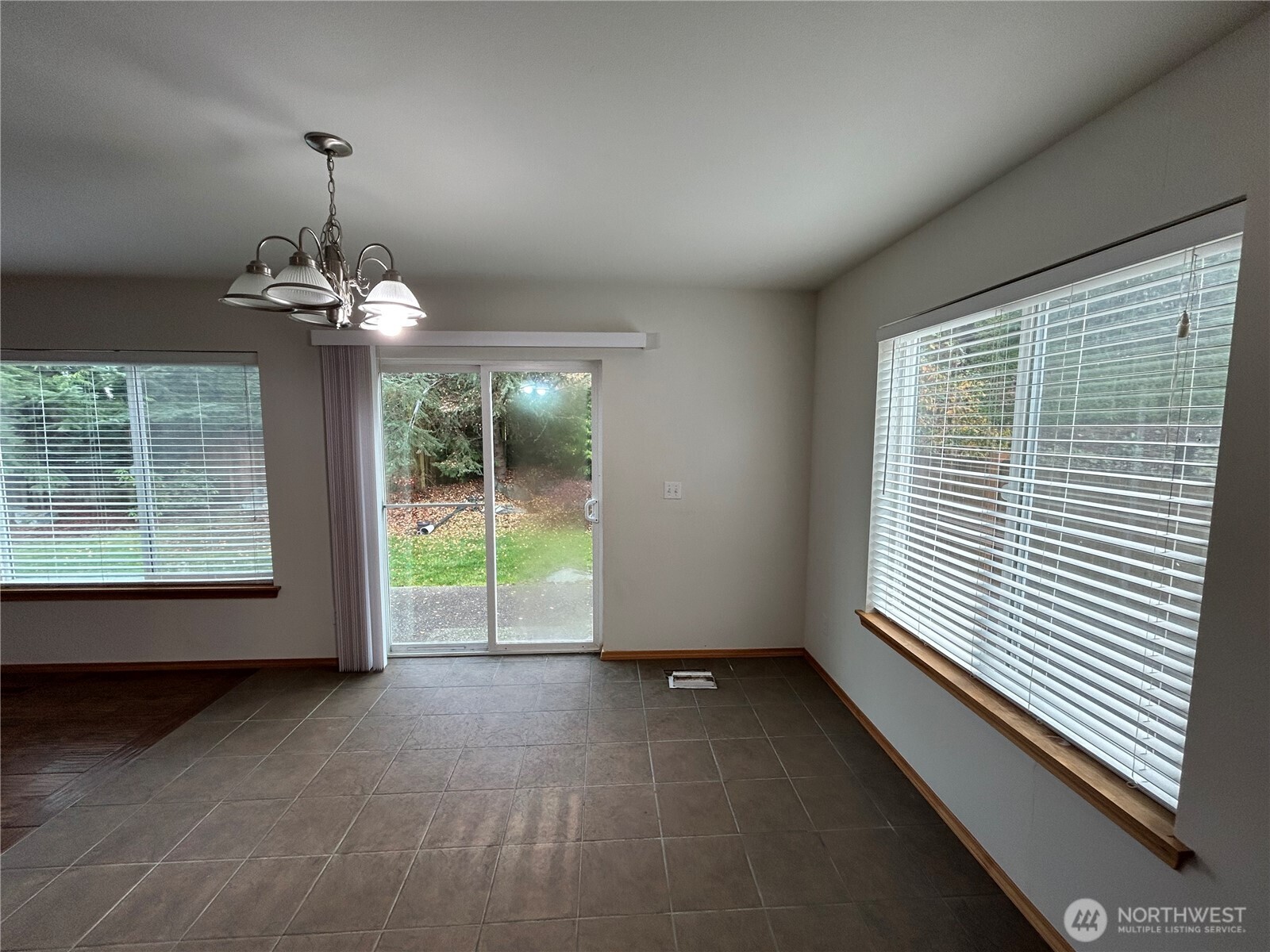 31114 29th Court Southwest Federal Way, WA 98023 - Photo 10 of 40 a view of a room with window wooden floor and table