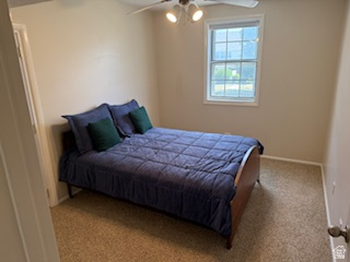 254 Meadow Lane Centerville, UT 84014 - Photo 28 of 34 Carpeted room featuring a ceiling fan with integrated lighting, neutral wall paint, and a double-pane window