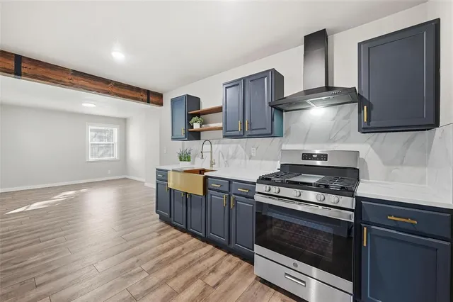 a kitchen with a stove and a refrigerator