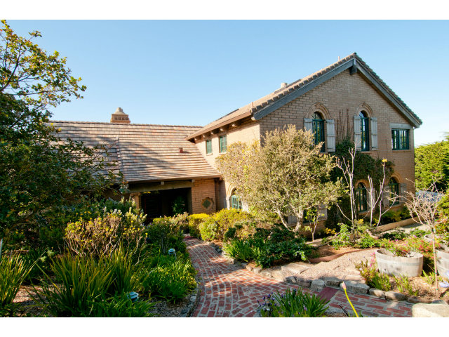 a front view of house along with wooden stairs