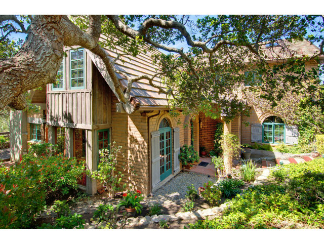 8 Mentone Road Carmel Highlands, CA 93923 - Photo 16 of 19 a front view of a house with a yard
