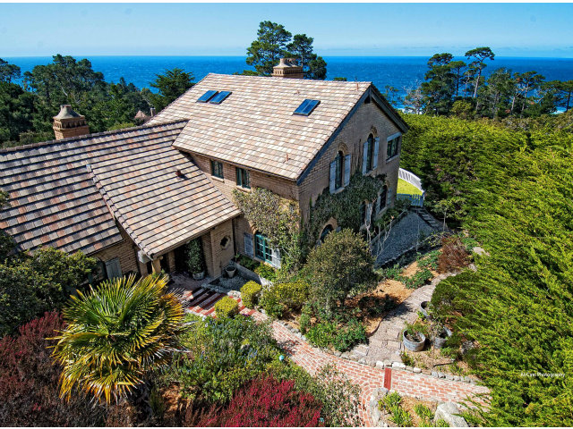 8 Mentone Road Carmel Highlands, CA 93923 - Photo 6 of 19 a view of a house with a flower garden
