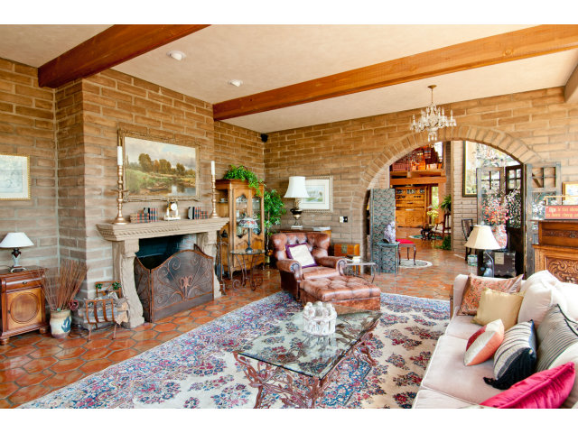8 Mentone Road Carmel Highlands, CA 93923 - Photo 10 of 19 a living room filled with furniture and a floor to ceiling window