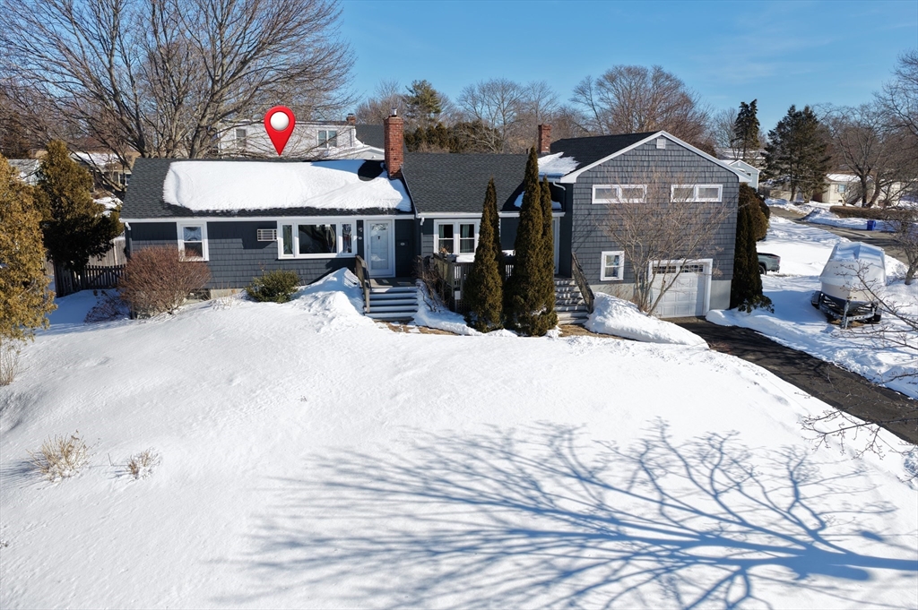 30 Haley Road, Unit 1 Marblehead, MA 01945 - Photo 1 of 21 a front view of a house with a yard covered in snow