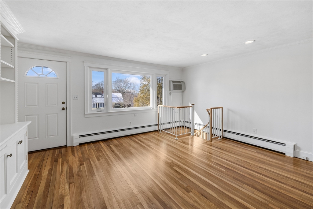 30 Haley Road, Unit 1 Marblehead, MA 01945 - Photo 2 of 21 wooden floor in an empty room with a window