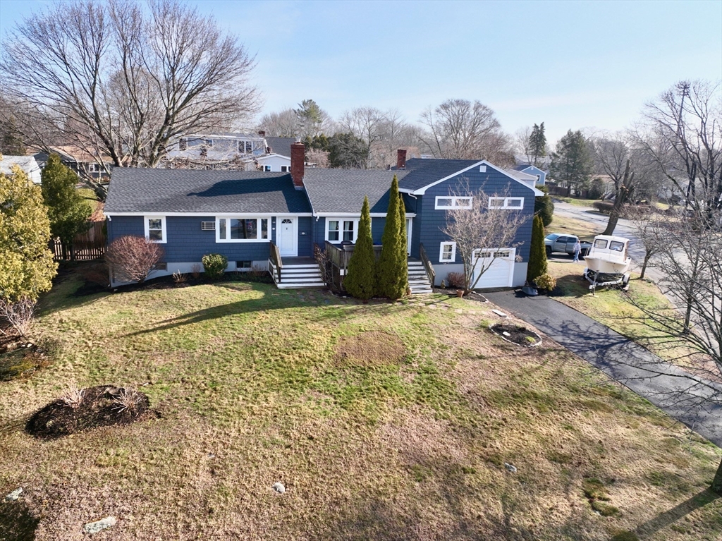 30 Haley Road, Unit 1 Marblehead, MA 01945 - Photo 21 of 21 a view of a house with a yard covered in snow