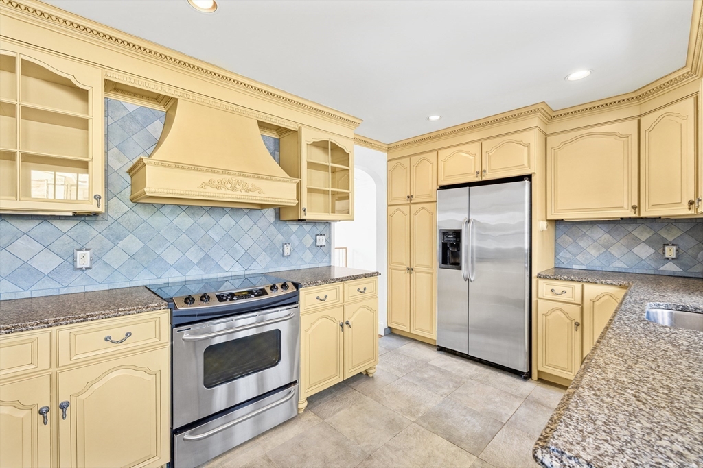 30 Haley Road, Unit 1 Marblehead, MA 01945 - Photo 5 of 21 a kitchen with a stove a sink and a refrigerator