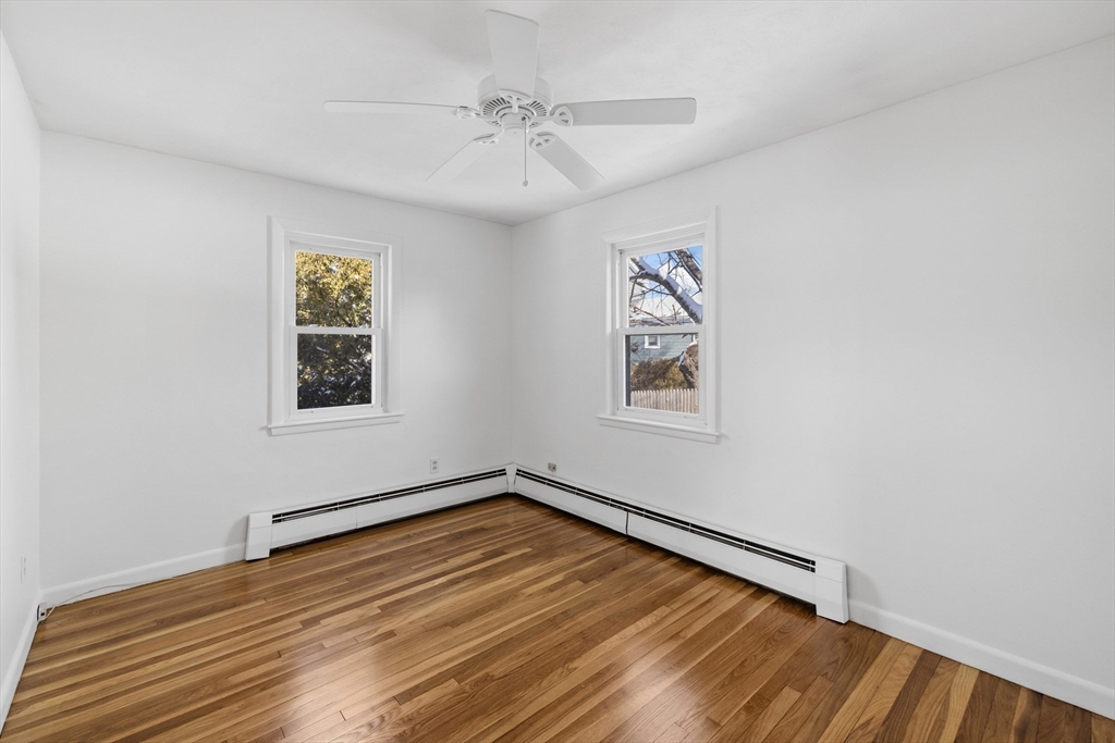 30 Haley Road, Unit 1 Marblehead, MA 01945 - Photo 7 of 21 wooden floor in an empty room with a window