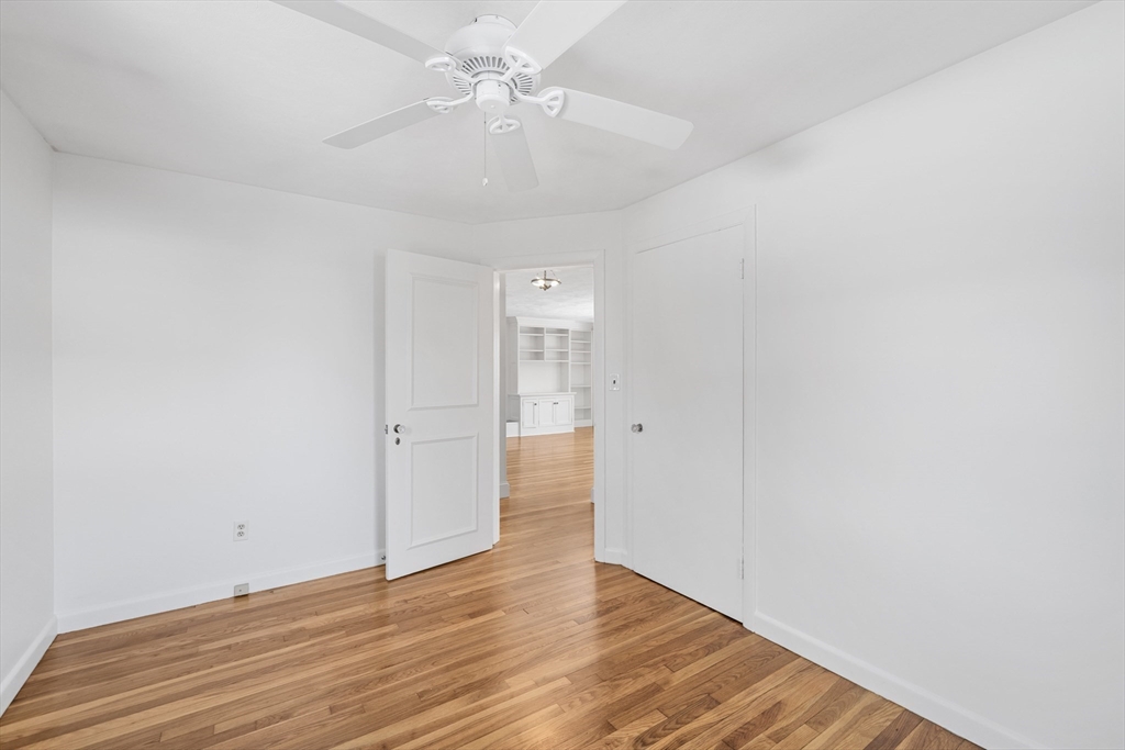 30 Haley Road, Unit 1 Marblehead, MA 01945 - Photo 8 of 21 a view of an empty room with wooden floor