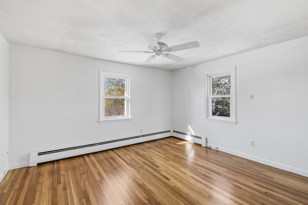 30 Haley Road, Unit 1 Marblehead, MA 01945 - Photo 10 of 21 wooden floor in an empty room with a window