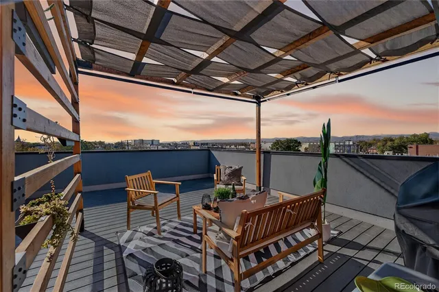 a view of a balcony with furniture