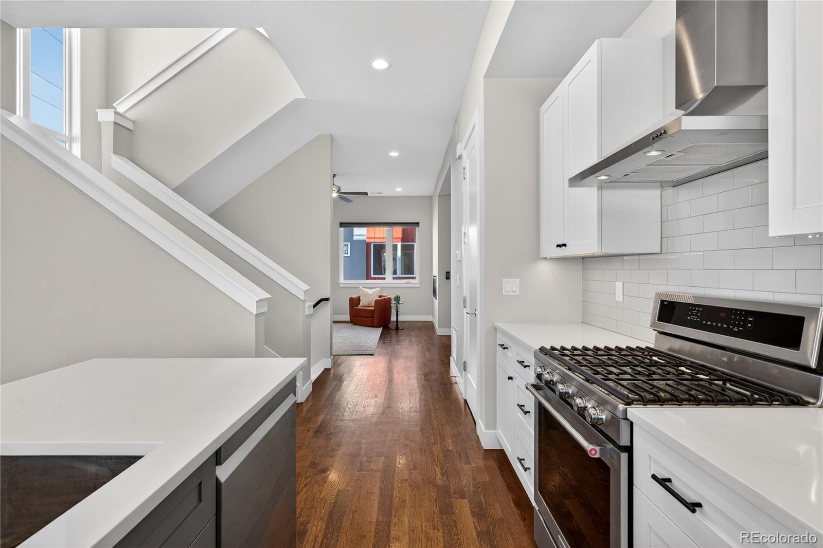 925 Inca Street, Unit 7 Denver, CO 80204 - Photo 14 of 42 a kitchen with a stove and a white cabinets