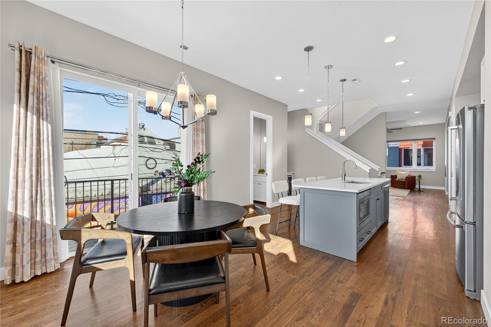925 Inca Street, Unit 7 Denver, CO 80204 - Photo 20 of 42 a dining room with furniture and wooden floor