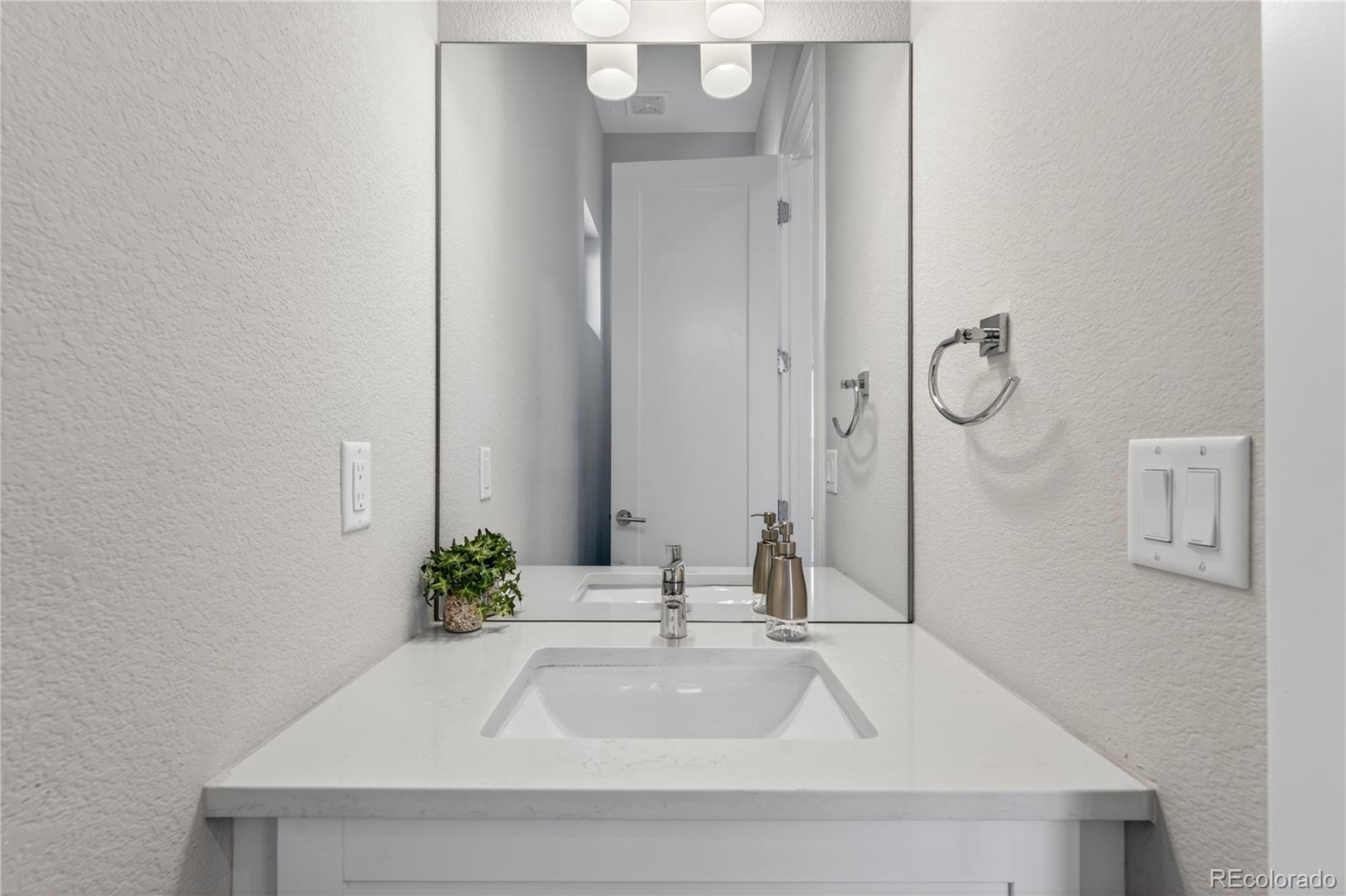 925 Inca Street, Unit 7 Denver, CO 80204 - Photo 21 of 42 a bathroom with a sink and a mirror