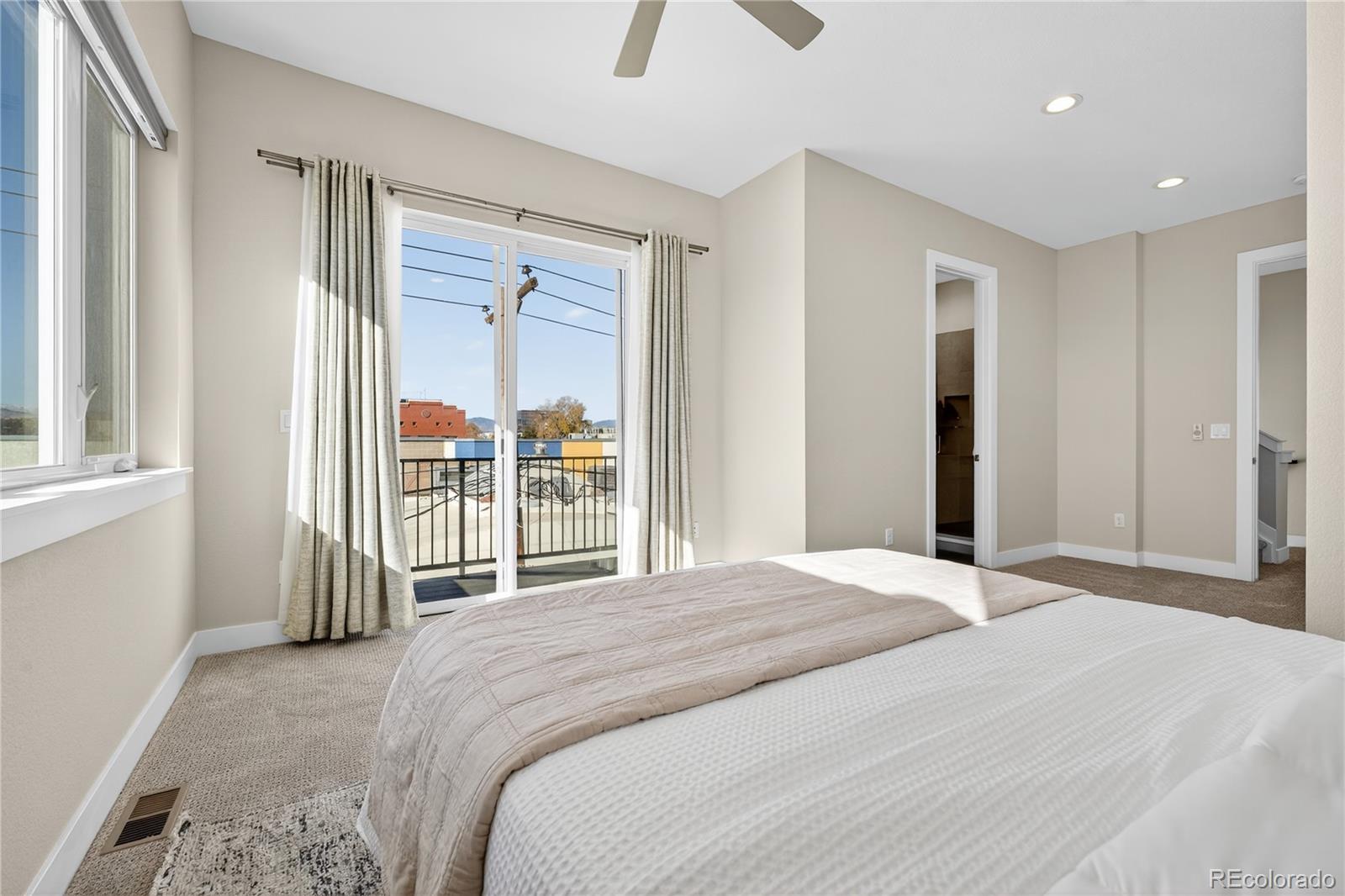 925 Inca Street, Unit 7 Denver, CO 80204 - Photo 24 of 42 a bedroom with a bed and a large window