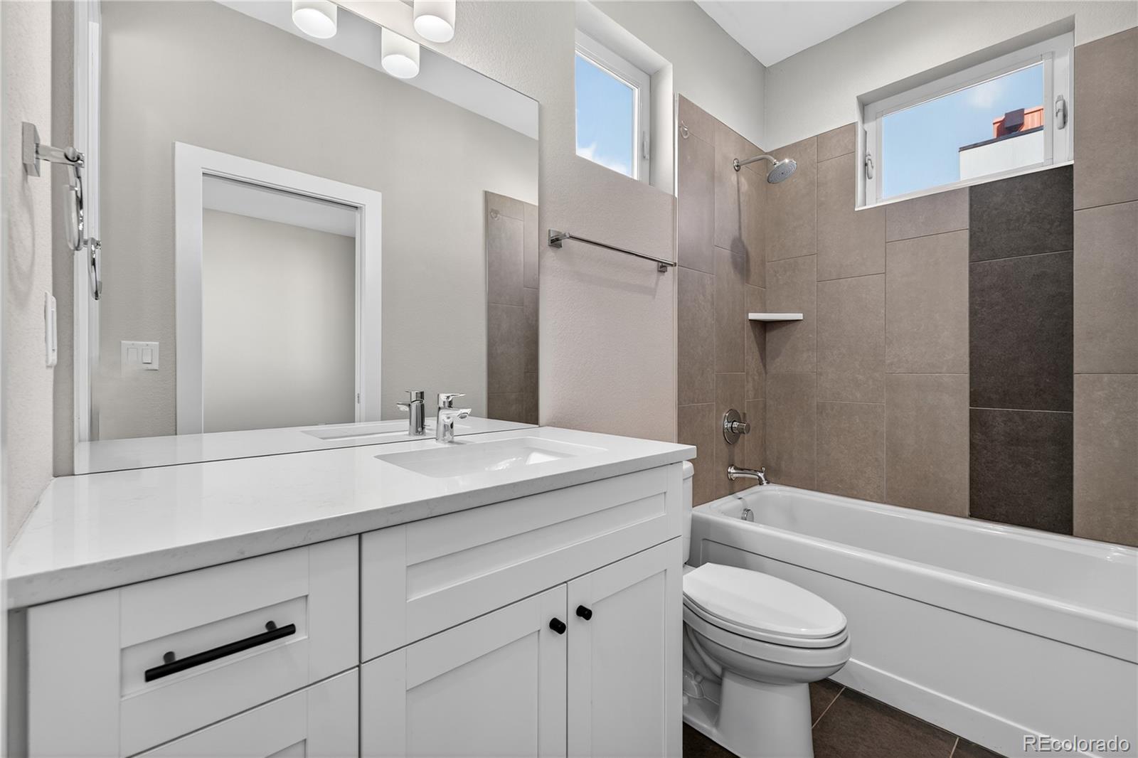 925 Inca Street, Unit 7 Denver, CO 80204 - Photo 31 of 42 a bathroom with a sink a toilet and a bathtub