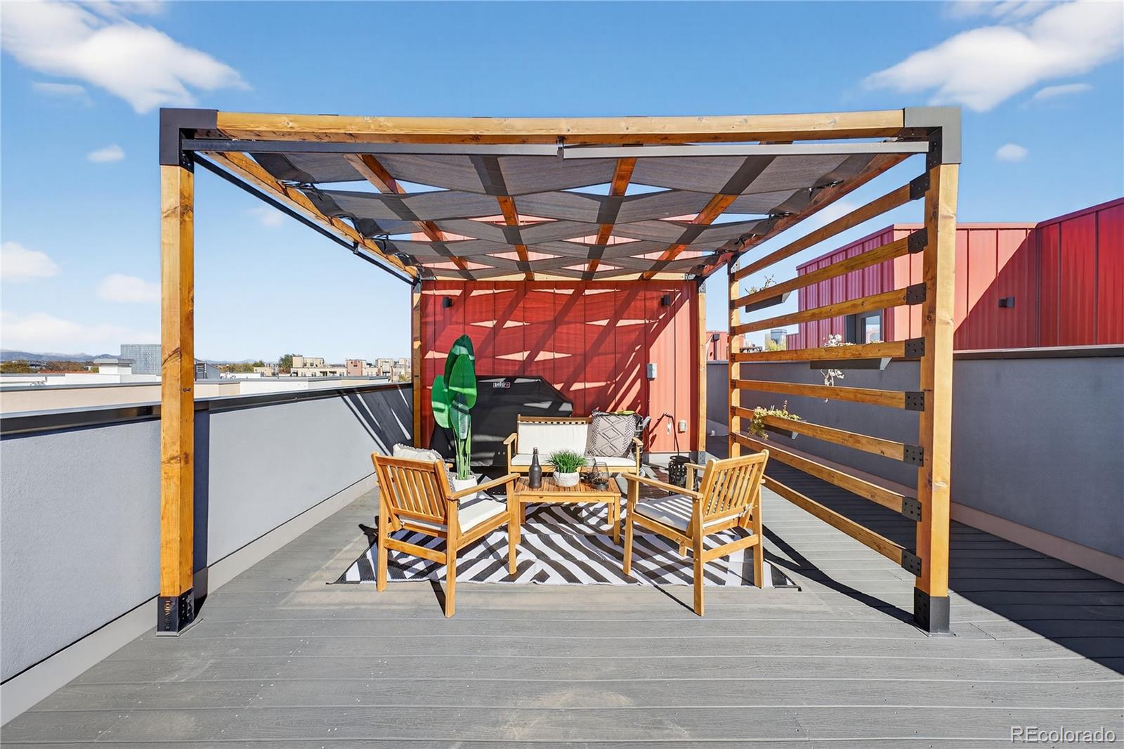 925 Inca Street, Unit 7 Denver, CO 80204 - Photo 35 of 42 a patio with table and chairs