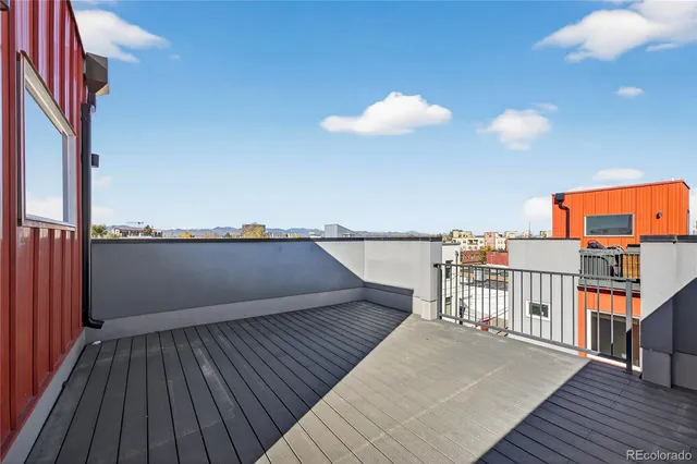 a view of a balcony with two chairs