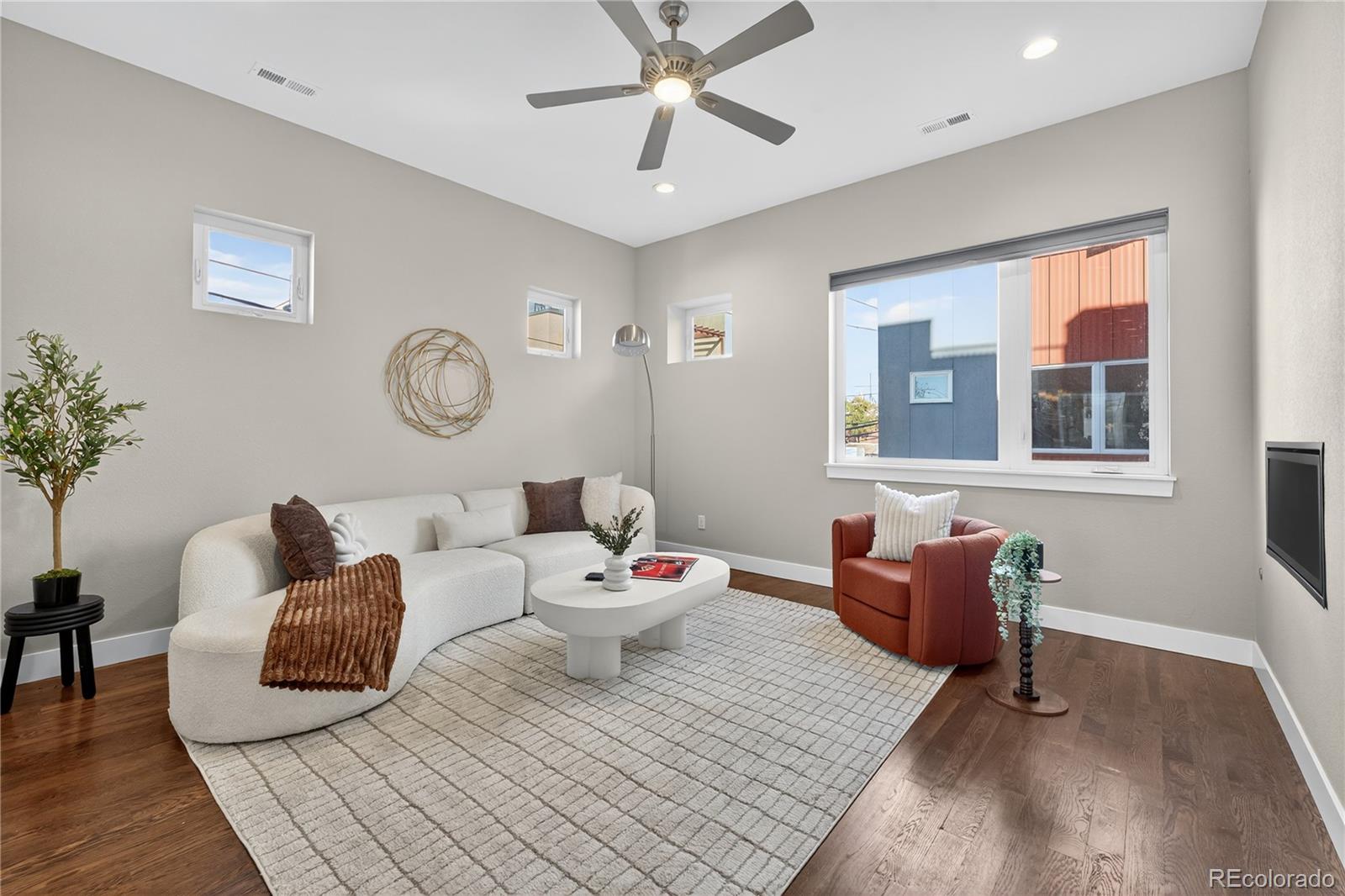 925 Inca Street, Unit 7 Denver, CO 80204 - Photo 10 of 42 a living room with furniture and wooden floor