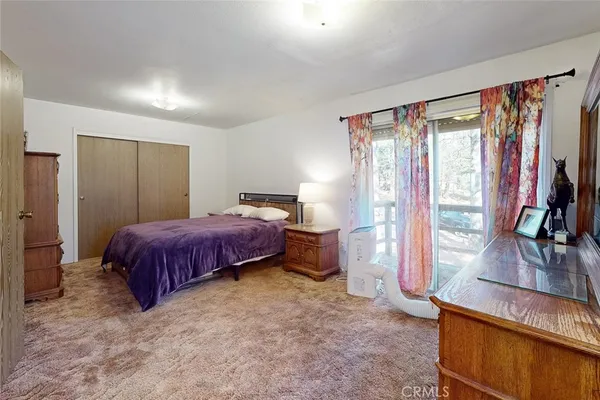 a bathroom with a toilet a sink and a mirror