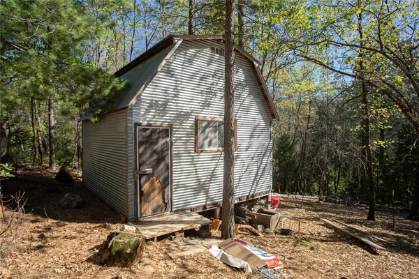 a view of backyard with patio