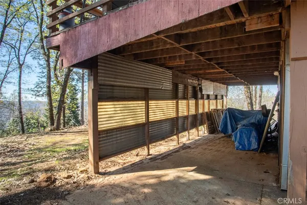 a view of balcony with wooden floor and fence