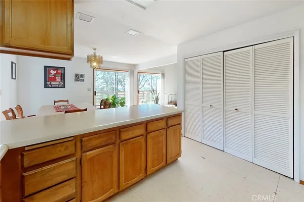 a kitchen with stainless steel appliances a refrigerator a sink a stove and cabinets