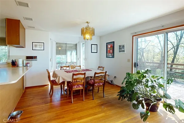 a living room with furniture fireplace and a large window