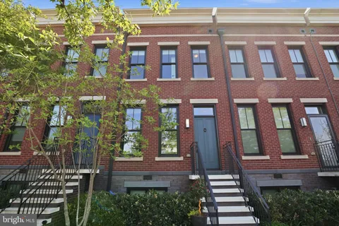 a front view of a multi story residential apartment building