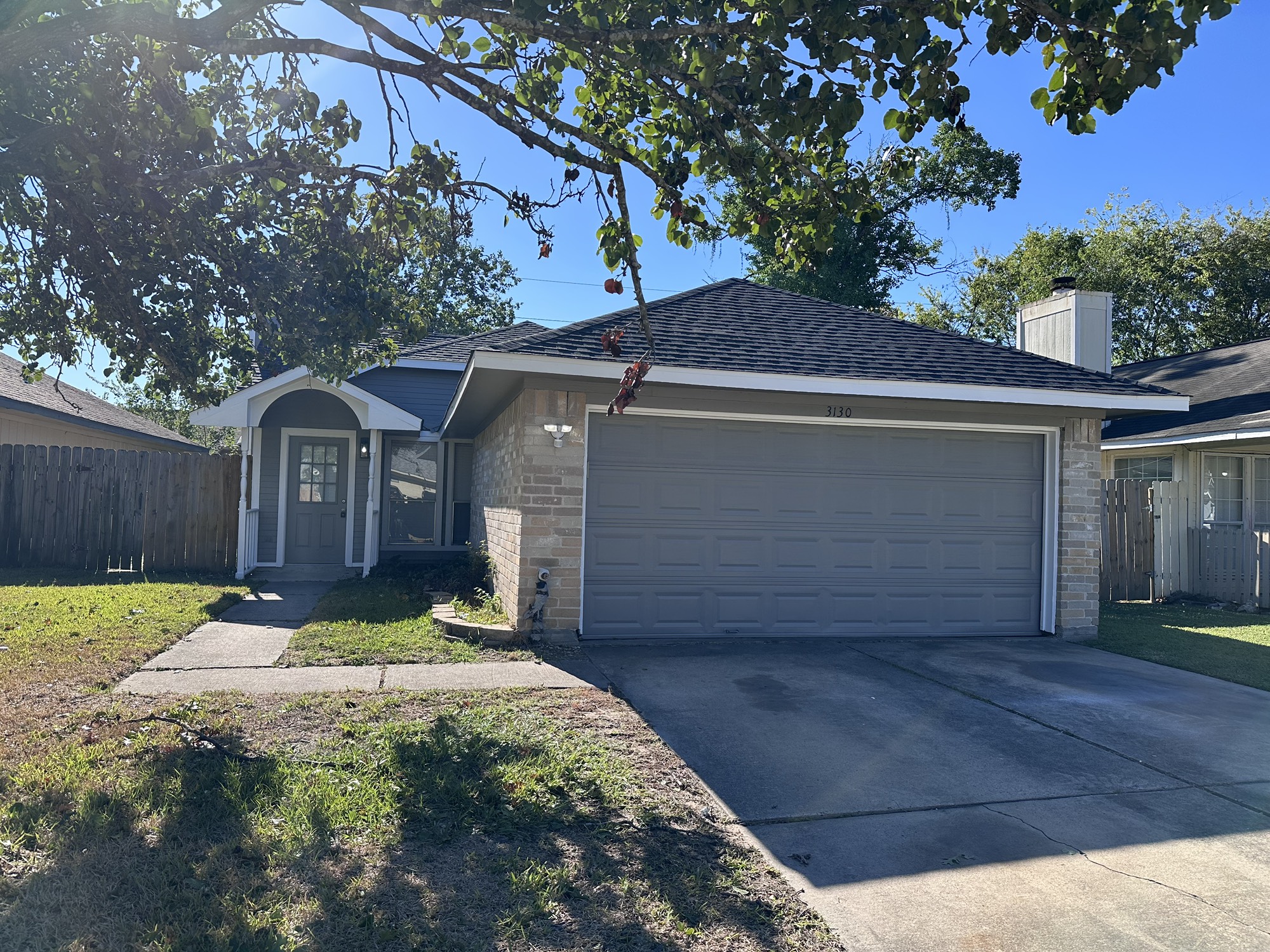 3130 Cottonshire Drive Spring, TX 77373 - Photo 1 of 32 a view of a house with a small yard plants and large tree
