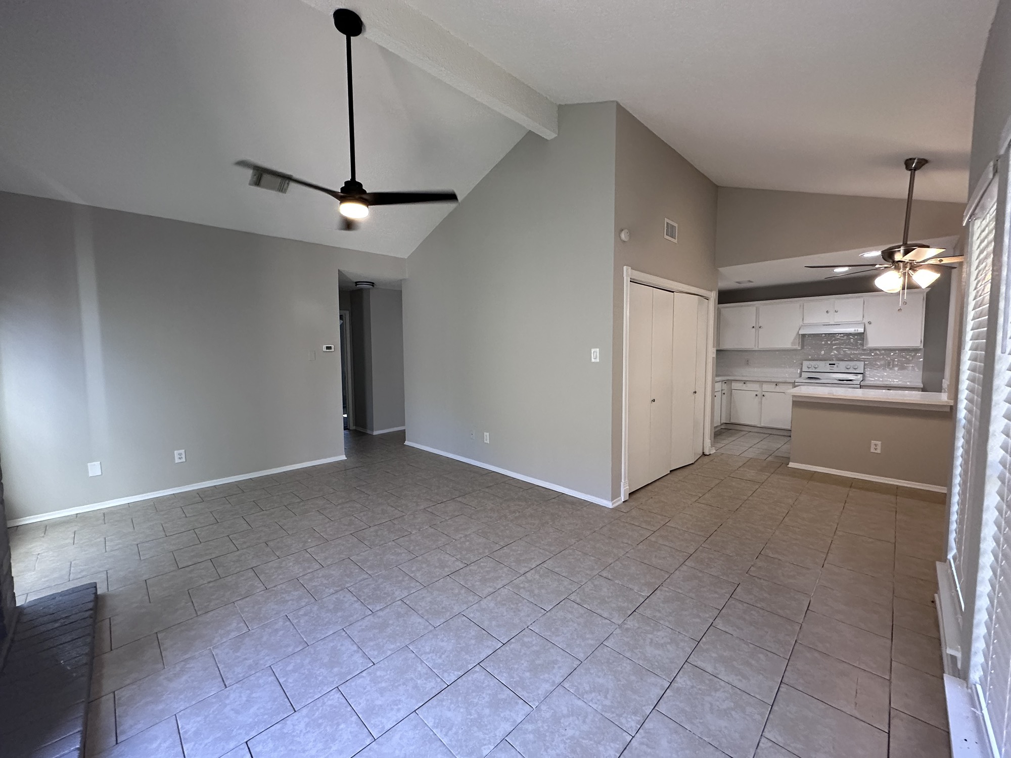 3130 Cottonshire Drive Spring, TX 77373 - Photo 12 of 32 a view of a kitchen with a sink and an empty room