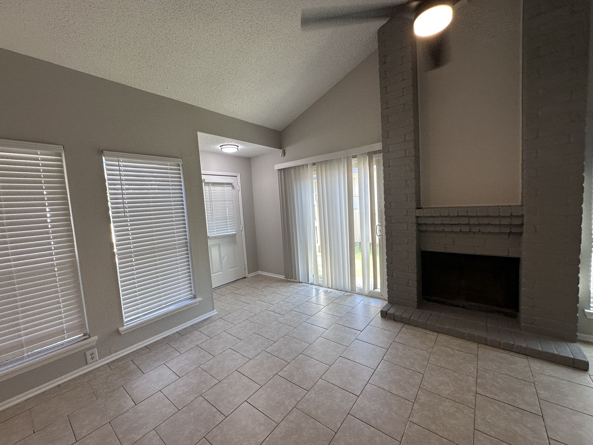 3130 Cottonshire Drive Spring, TX 77373 - Photo 17 of 32 an empty room with windows and fireplace