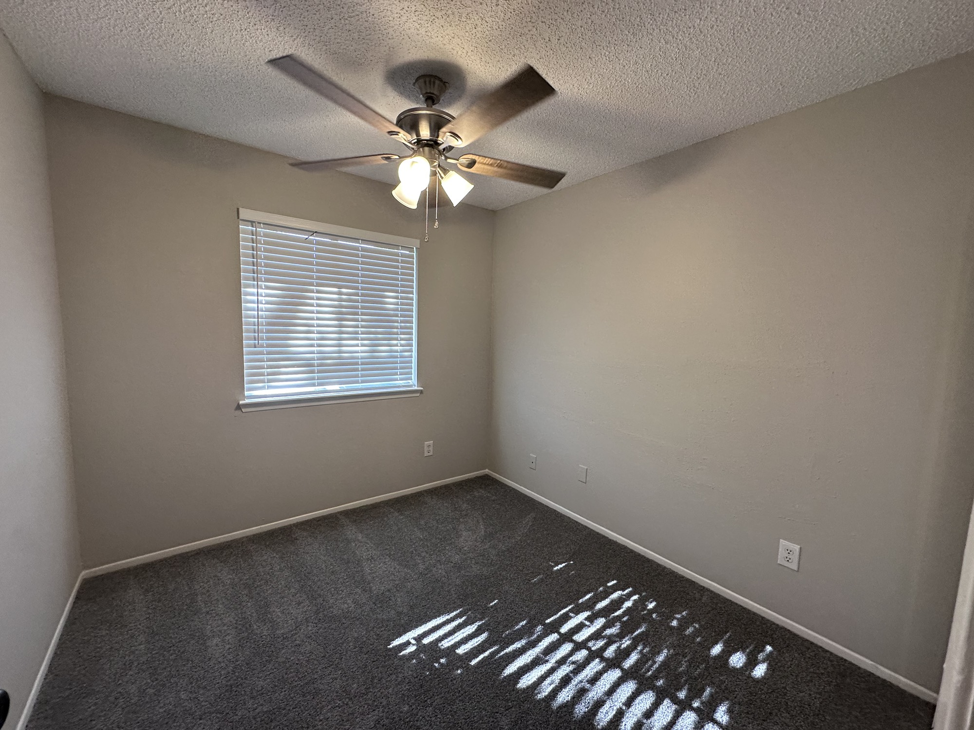 3130 Cottonshire Drive Spring, TX 77373 - Photo 19 of 32 an empty room with windows and fan