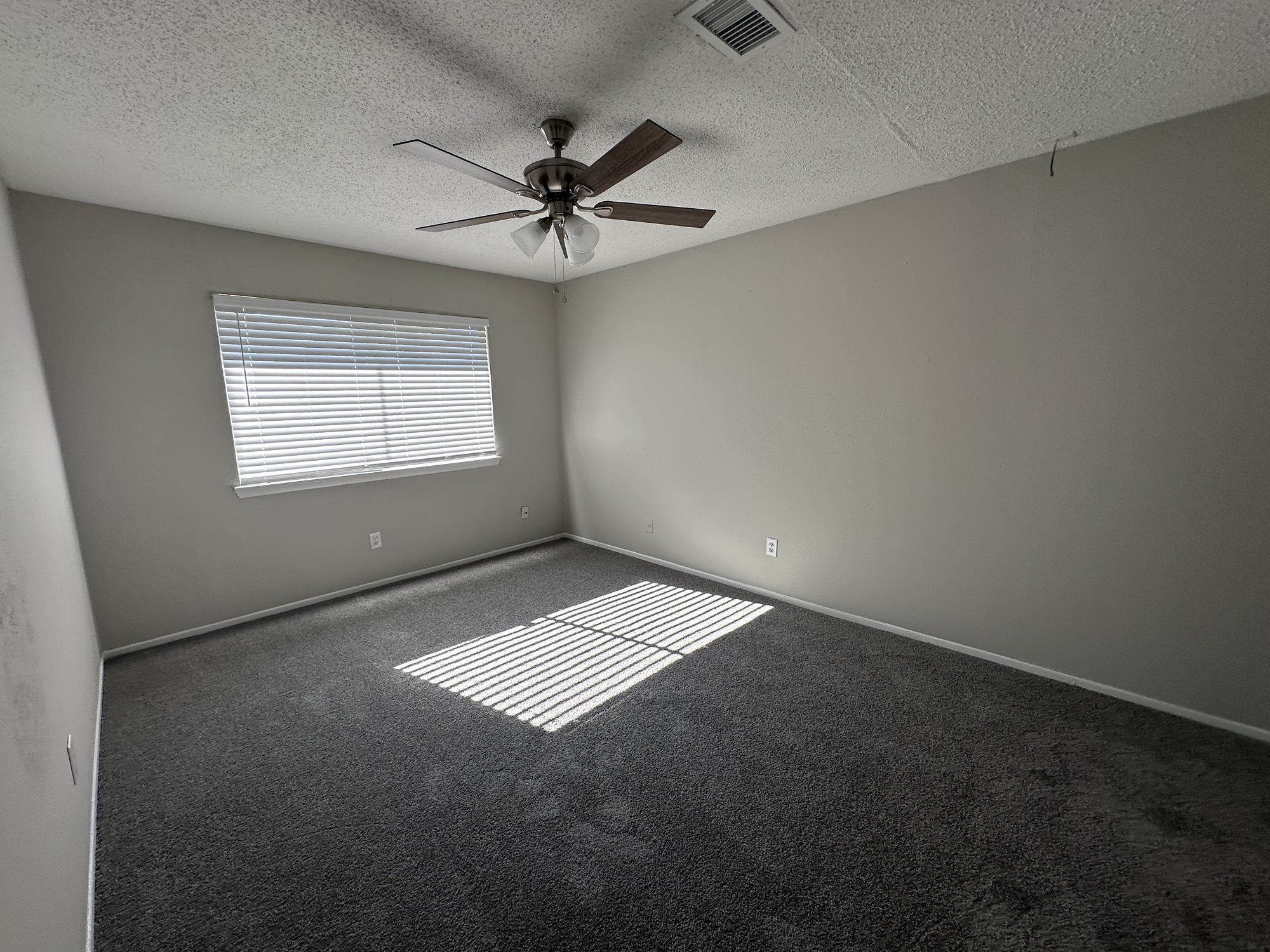3130 Cottonshire Drive Spring, TX 77373 - Photo 20 of 32 an empty room with a window and a ceiling fan