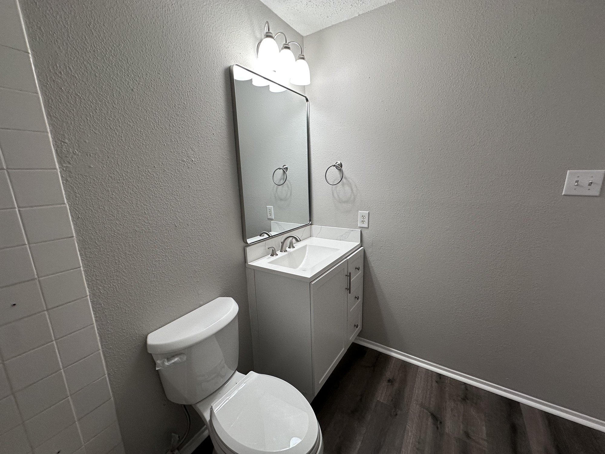 3130 Cottonshire Drive Spring, TX 77373 - Photo 23 of 32 a bathroom with a toilet sink and mirror