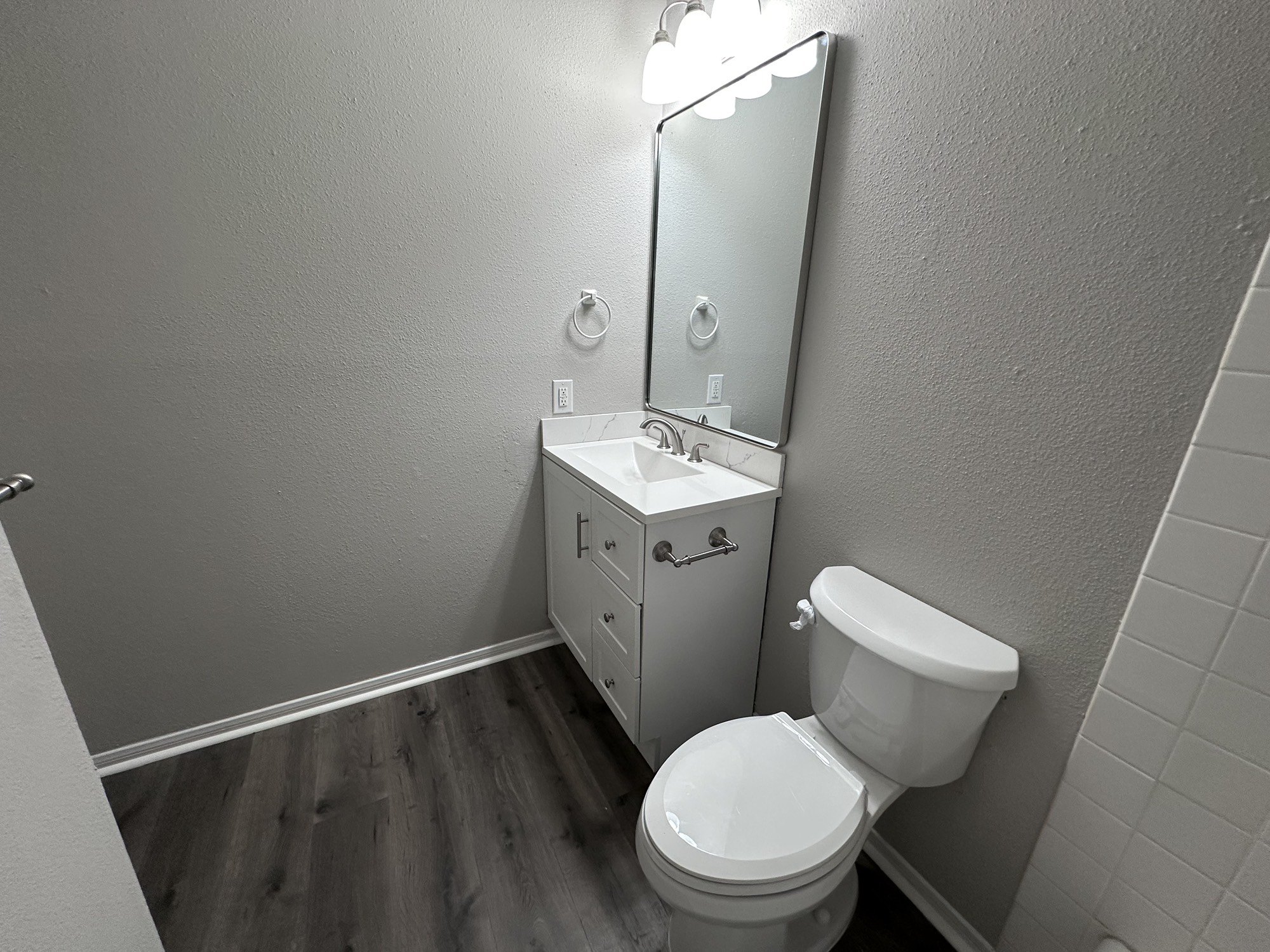 3130 Cottonshire Drive Spring, TX 77373 - Photo 25 of 32 a bathroom with a toilet sink and mirror