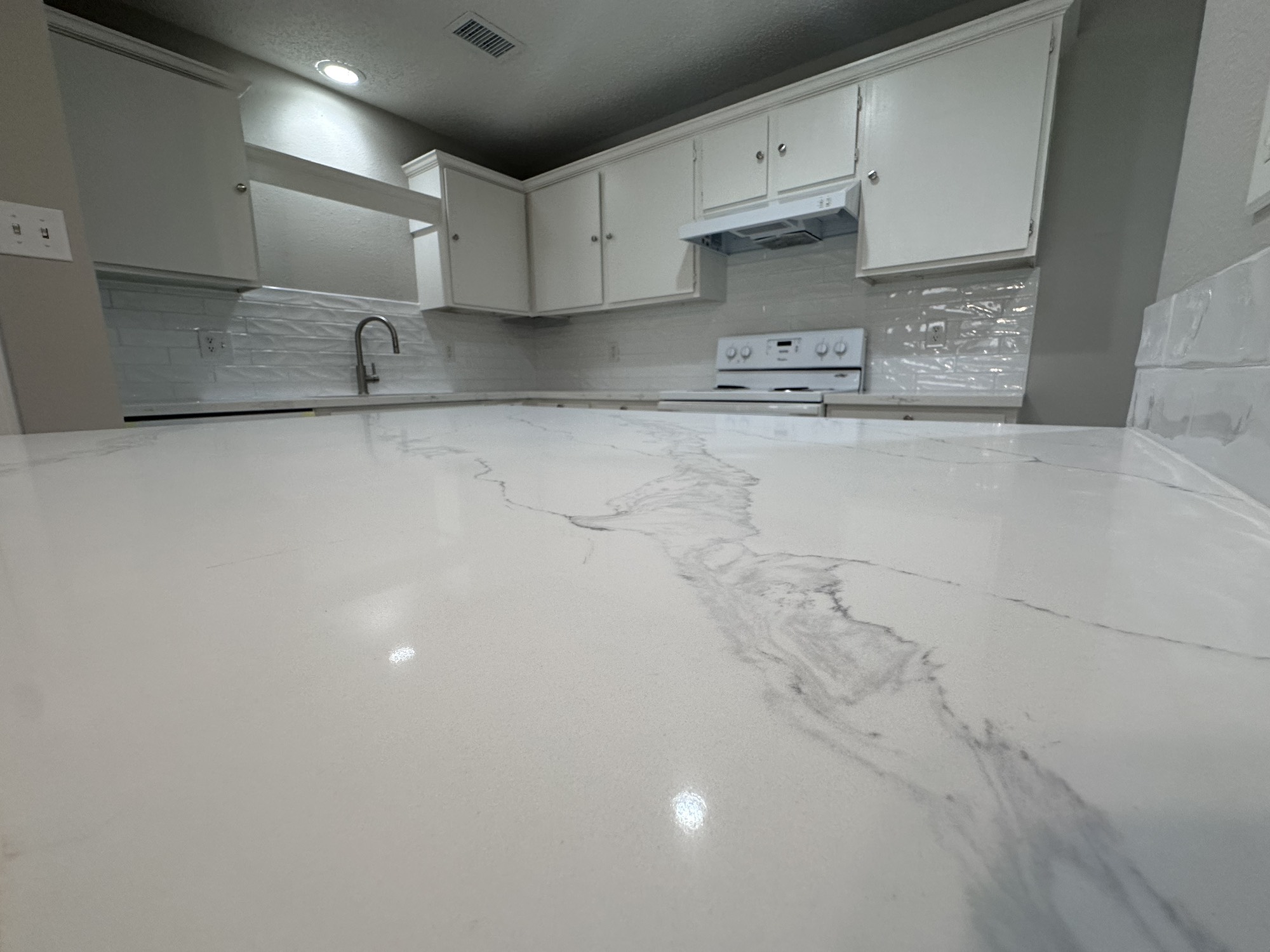 3130 Cottonshire Drive Spring, TX 77373 - Photo 5 of 32 a kitchen with granite countertop white cabinets and a sink