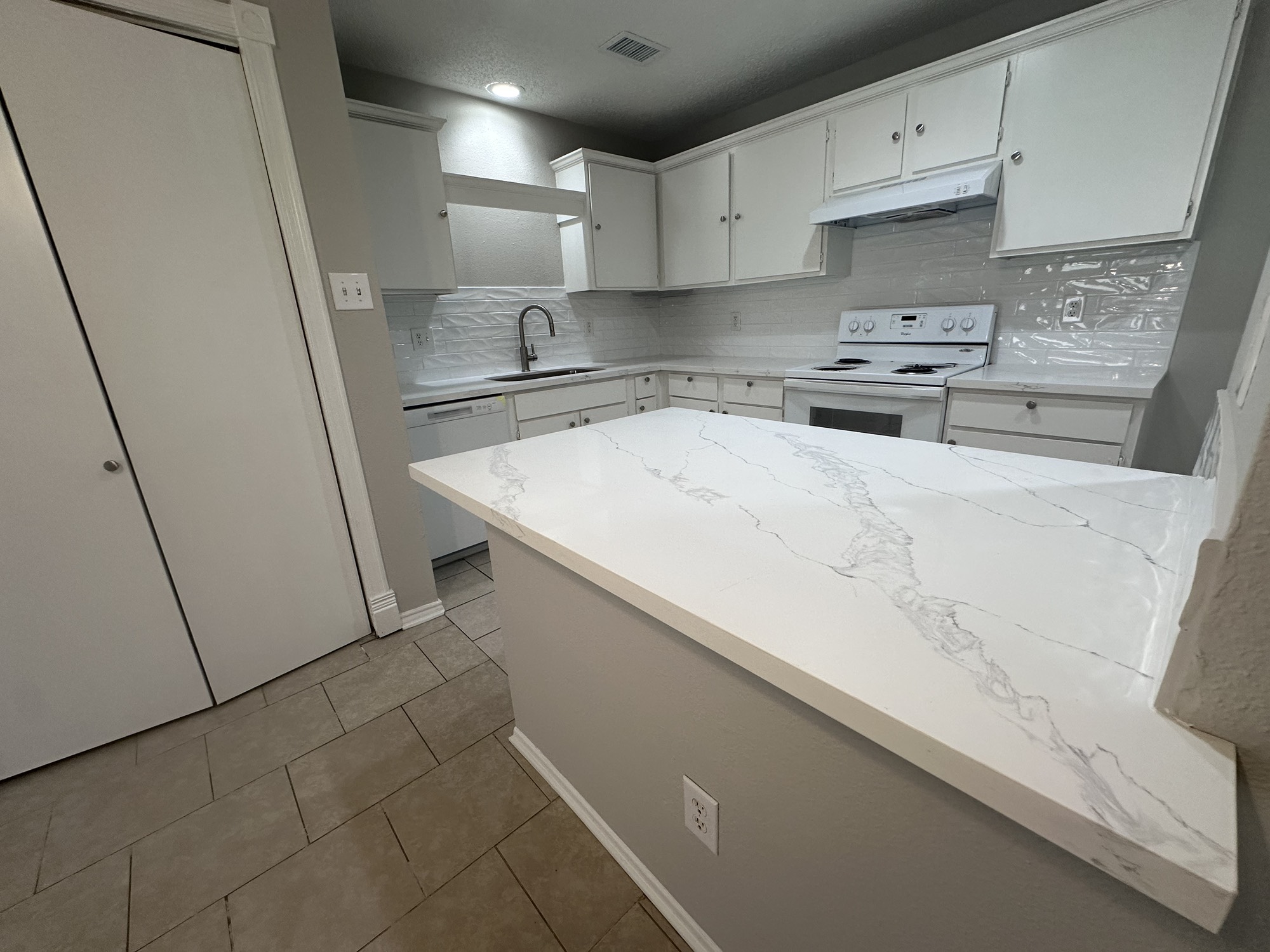 3130 Cottonshire Drive Spring, TX 77373 - Photo 6 of 32 a kitchen with stainless steel appliances a sink stove and cabinets