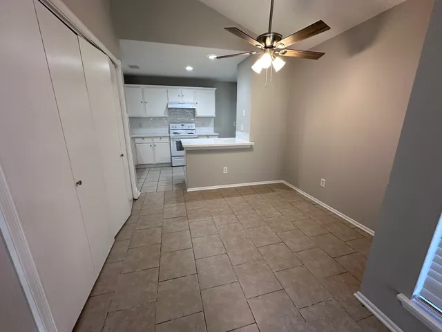 a view of a kitchen with a sink and a window