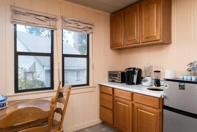 a kitchen with stainless steel appliances granite countertop sink and cabinets