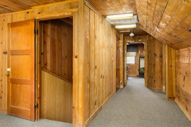 a view of a hallway with a door