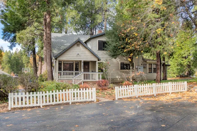 a front view of a house with a fence