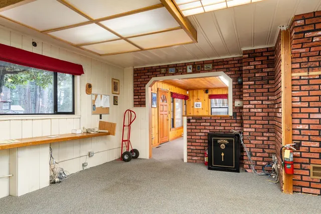 a view of a room with furniture and a fireplace
