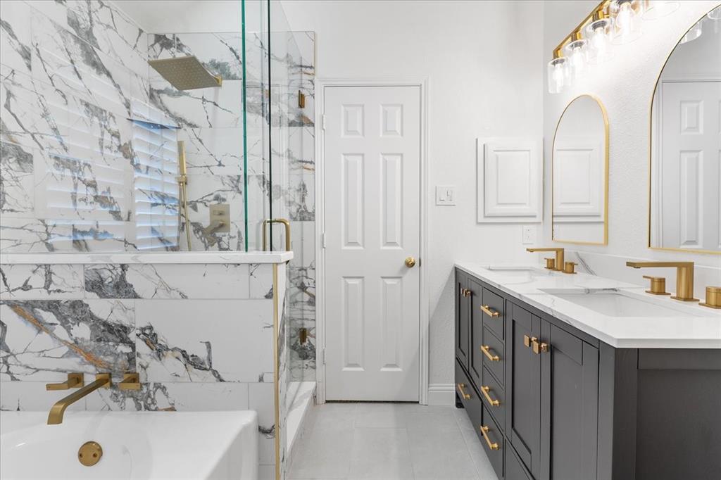 3701 Regency Circle Fort Worth, TX 76137 - Photo 1 of 31 a bathroom with a tub sink and mirror